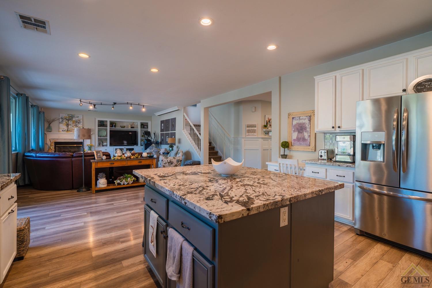 Undisclosed Address Bakersfield, CA 93312 - Photo 8 of 33 a kitchen with stainless steel appliances granite countertop a sink counter space and refrigerator
