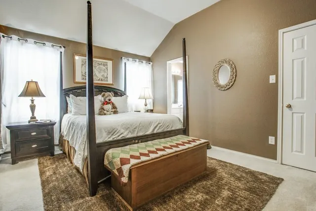 a bed room with a bed and a window