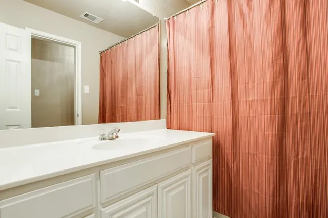 a sink with a mirror