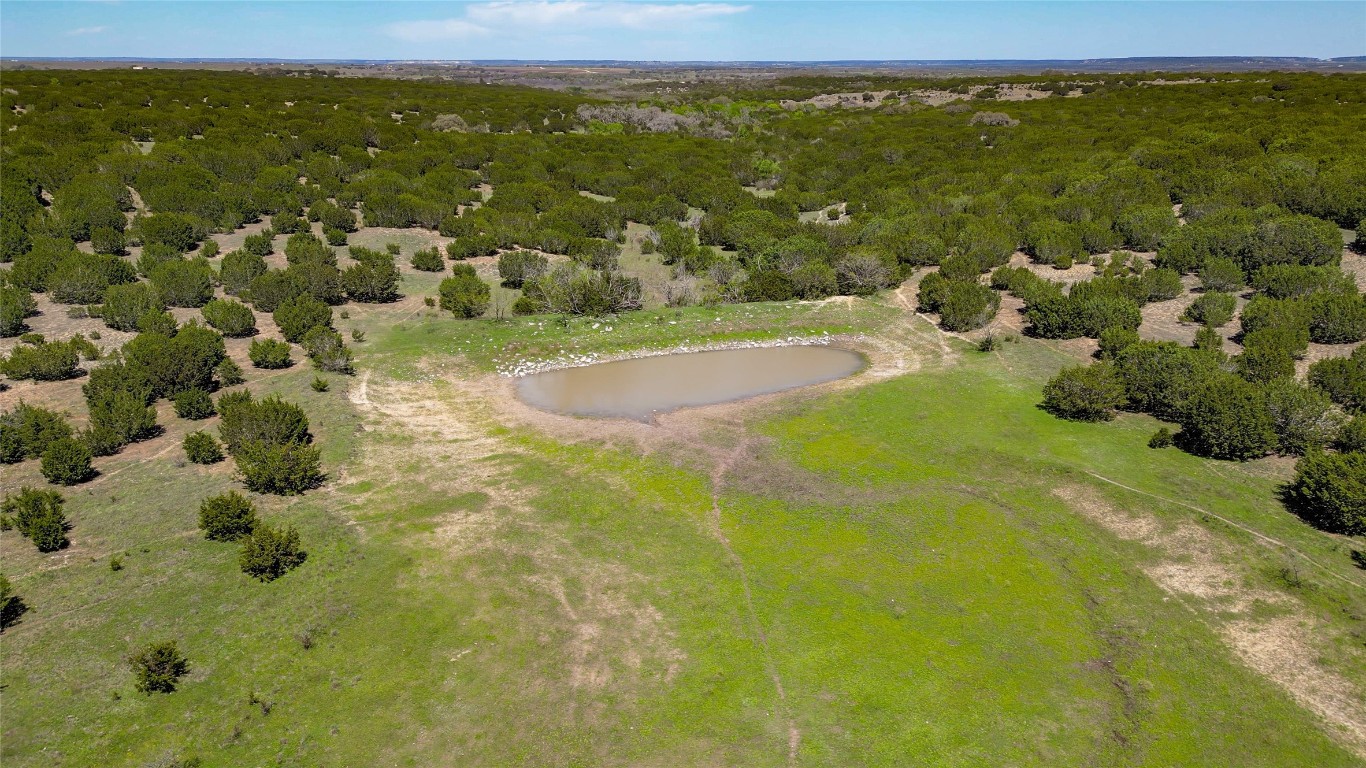 4121 County Road 2719 Evant, TX 76525 - Photo 20 of 37 a view of a lake with a city