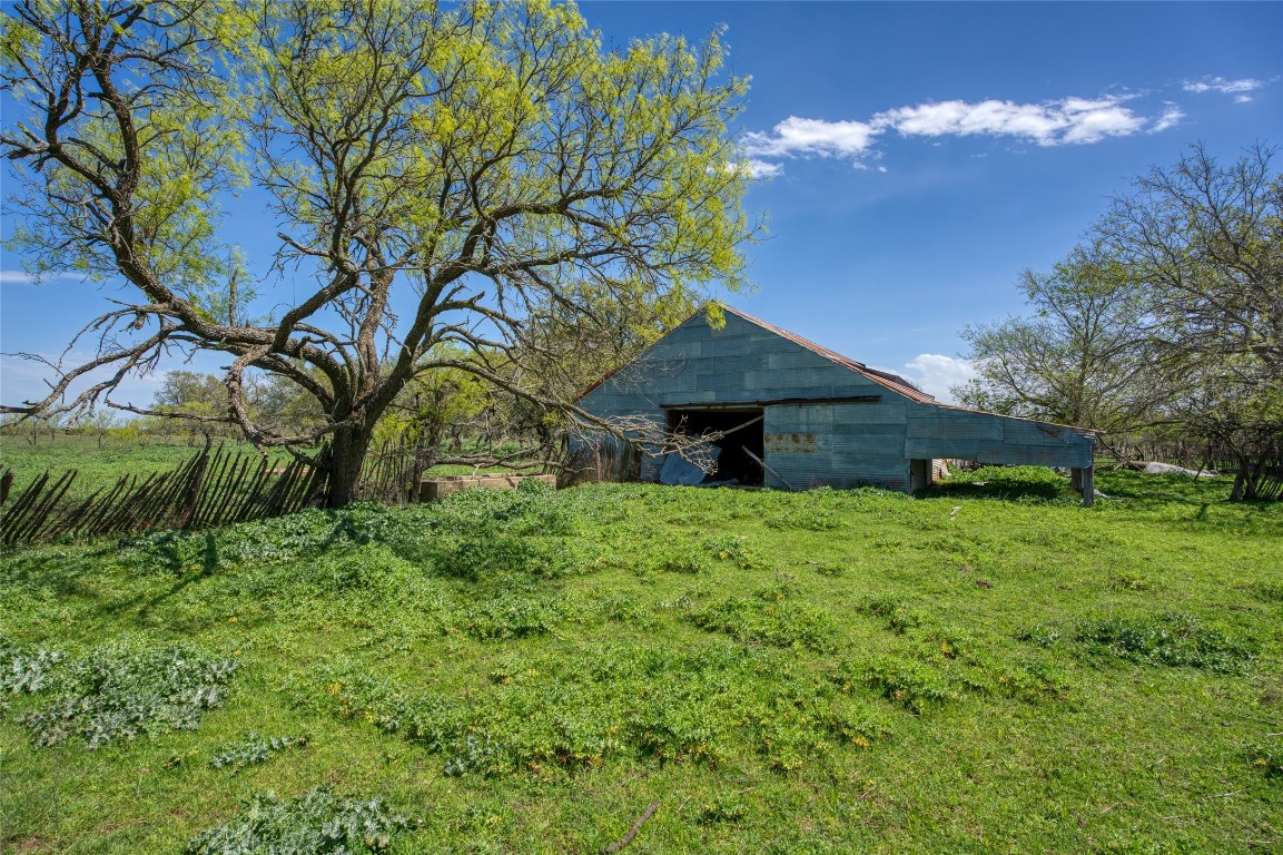 4121 County Road 2719 Evant, TX 76525 - Photo 35 of 37 a backyard of a house with lots of green space
