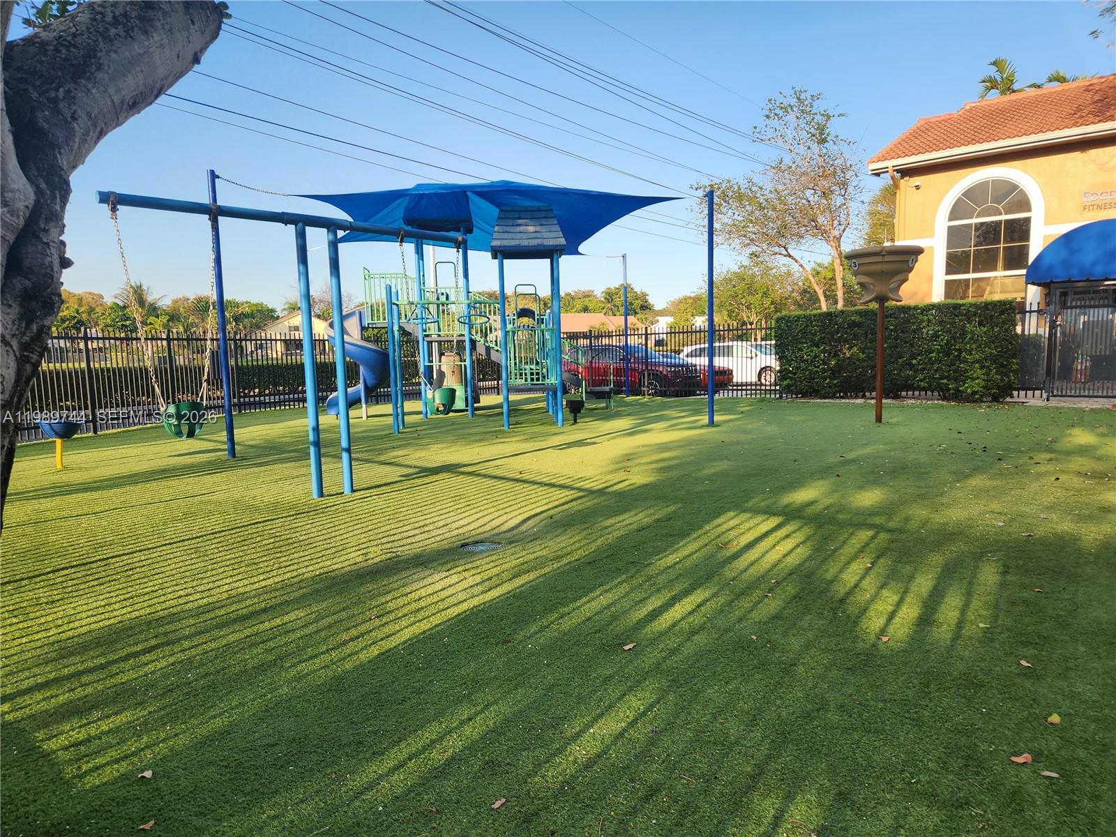 8761 Wiles Road, Unit 206 Coral Springs, FL 33067 - Photo 15 of 16 a view of a volley ball court