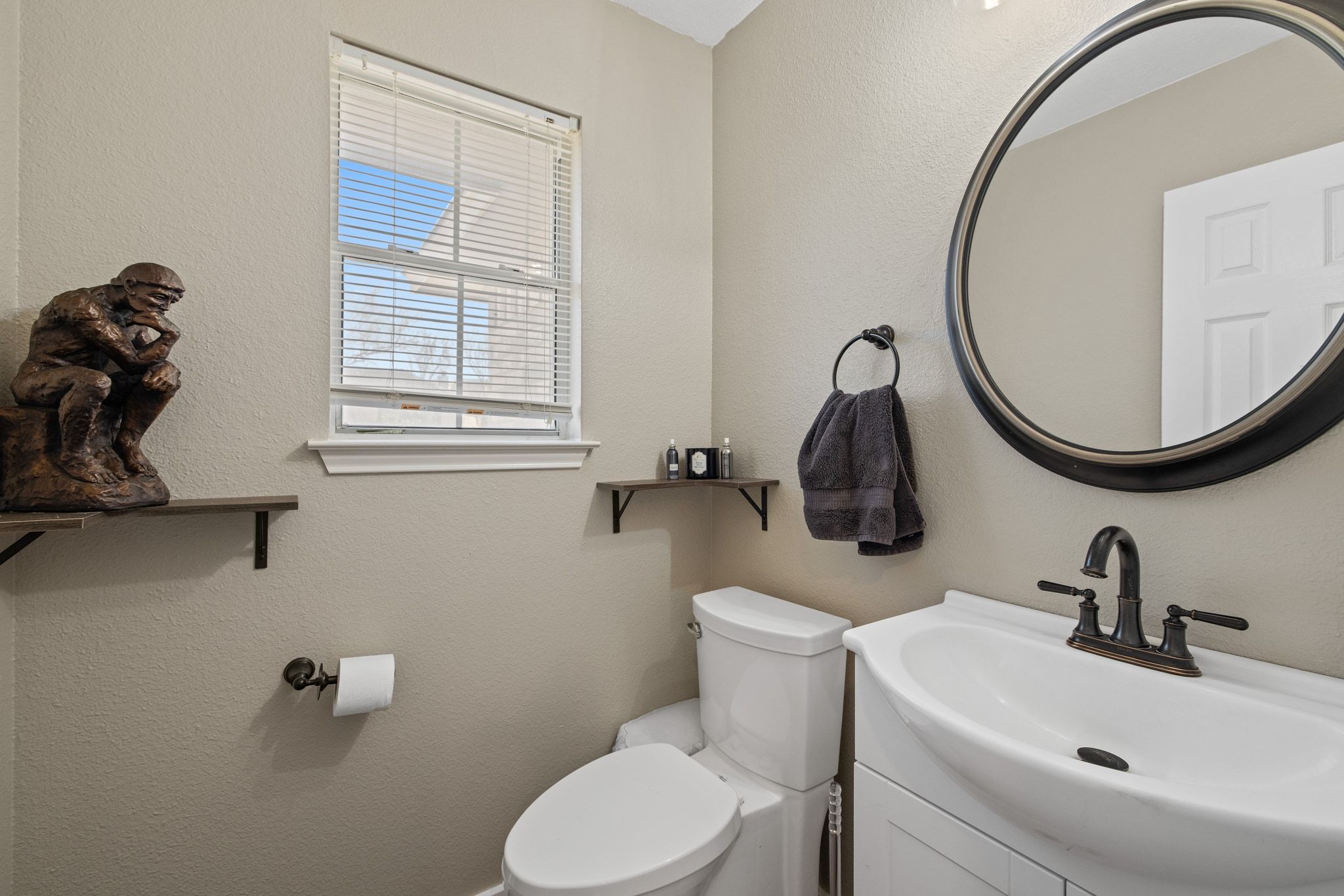 1607 Rio Bravo Loop Leander, TX 78641 - Photo 12 of 31 a bathroom with a sink a toilet and a mirror