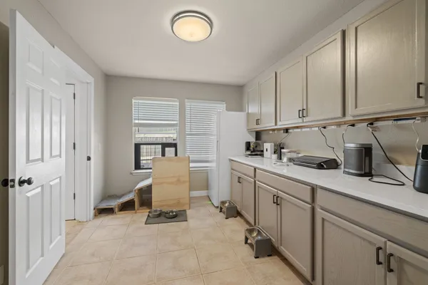 a bathroom with a sink a mirror a vanity and shower