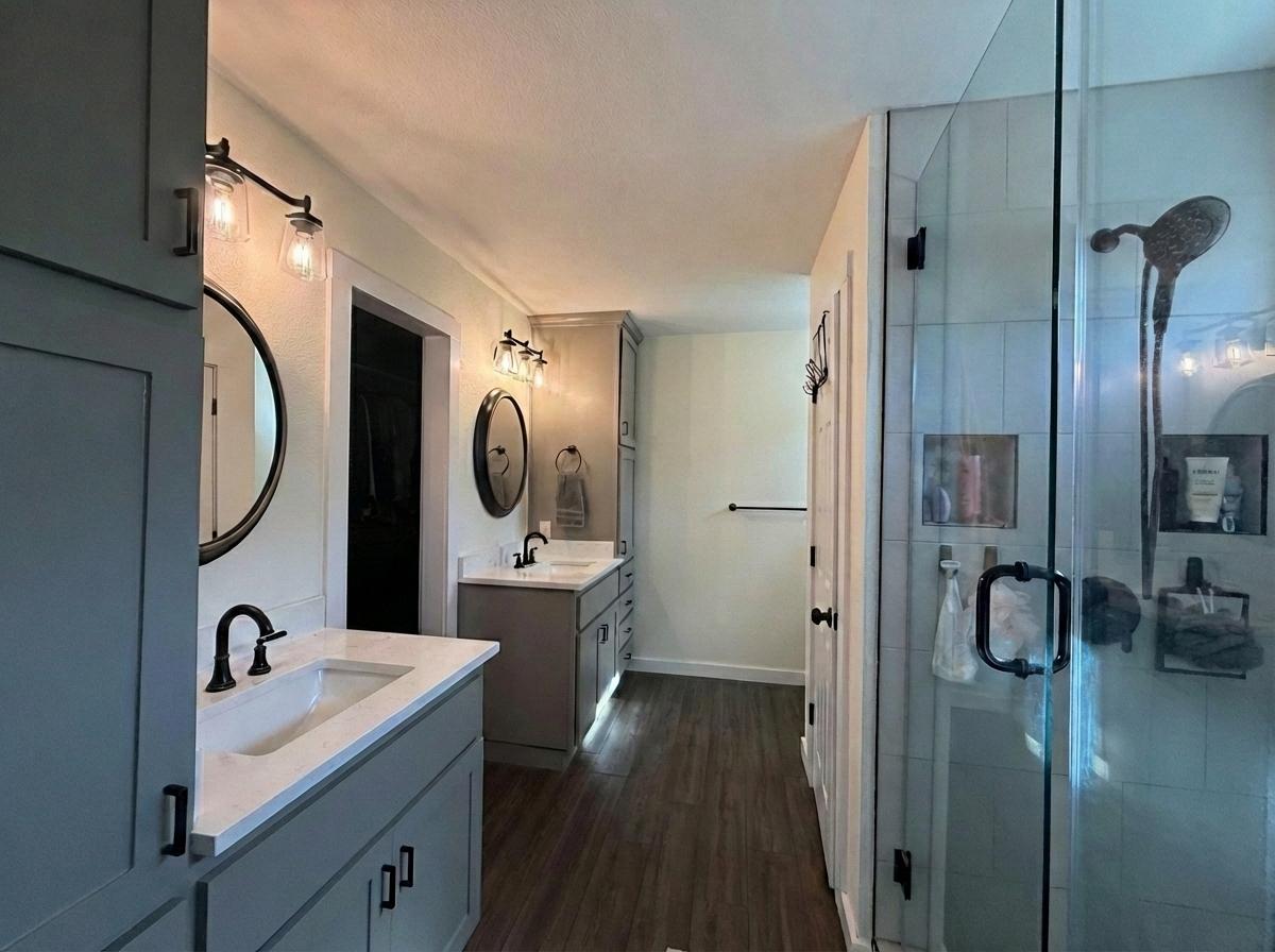 1607 Rio Bravo Loop Leander, TX 78641 - Photo 17 of 31 a bathroom with a sink a mirror a vanity and shower