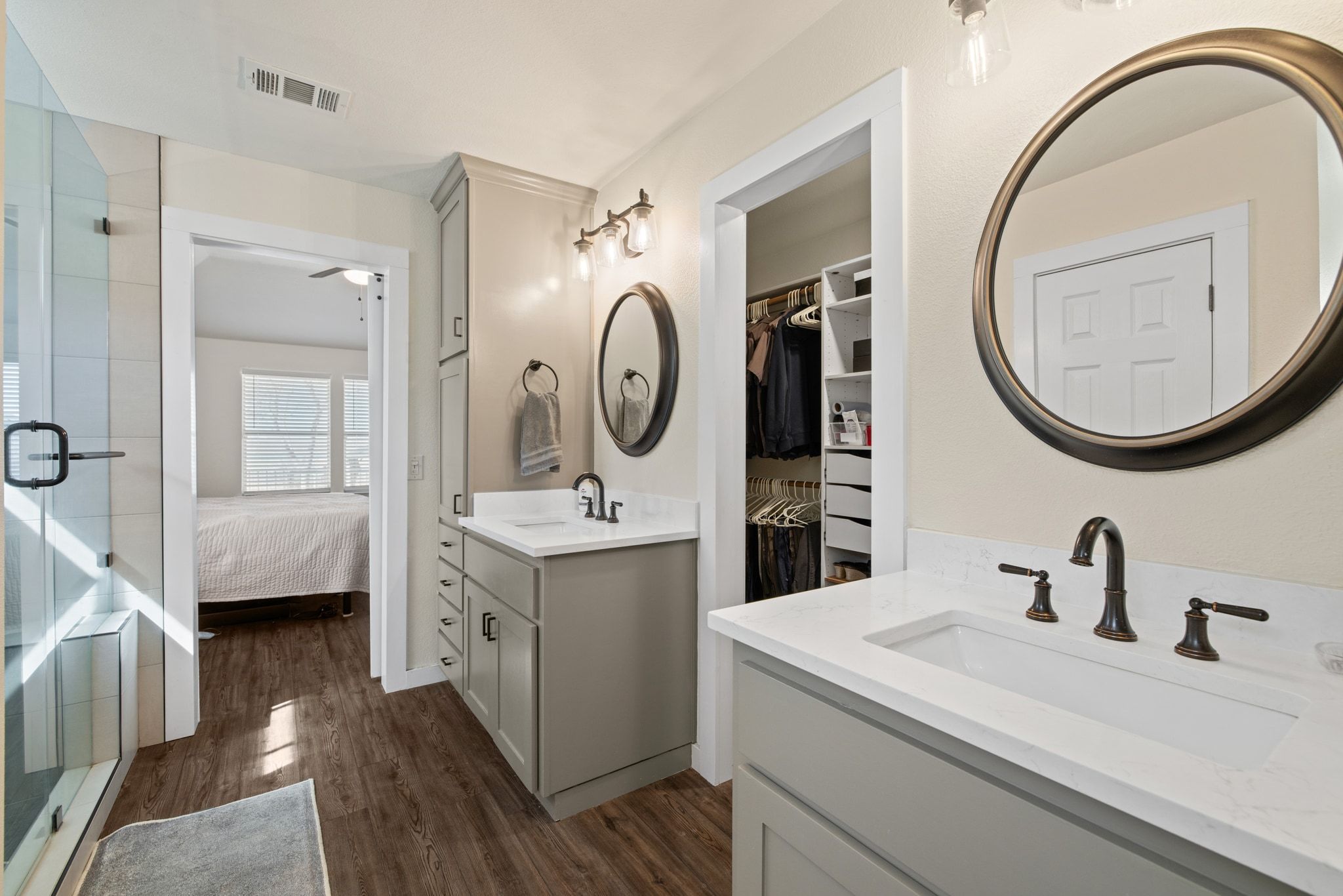 1607 Rio Bravo Loop Leander, TX 78641 - Photo 18 of 31 a en suite bathroom with a granite countertop sink and a mirror