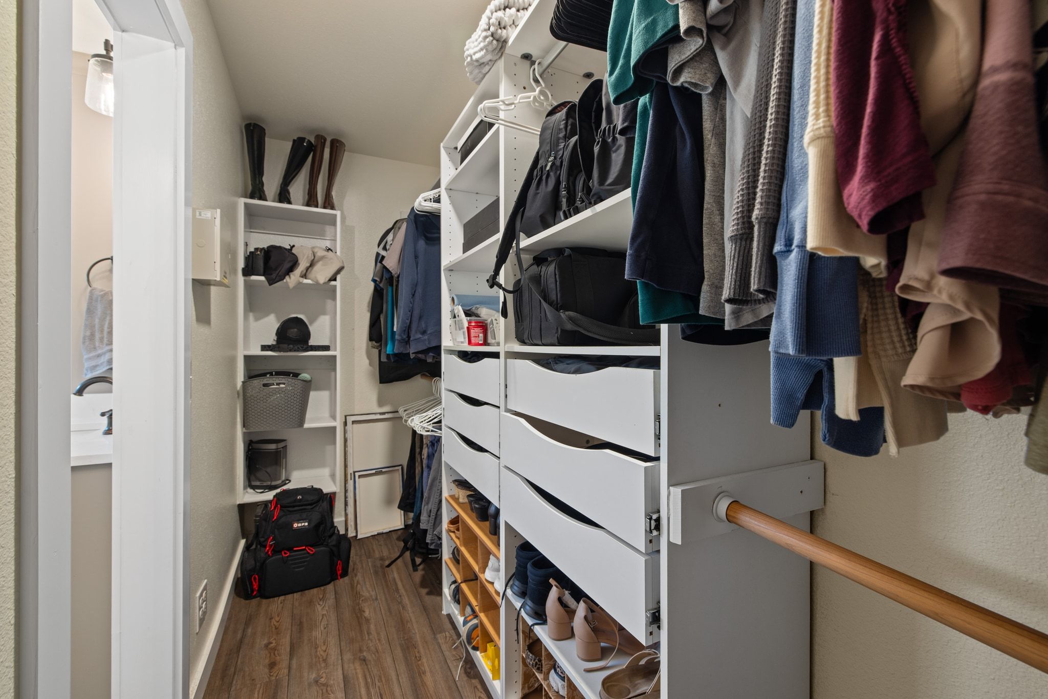 1607 Rio Bravo Loop Leander, TX 78641 - Photo 19 of 31 a view of walk in closet with clothes and shoes