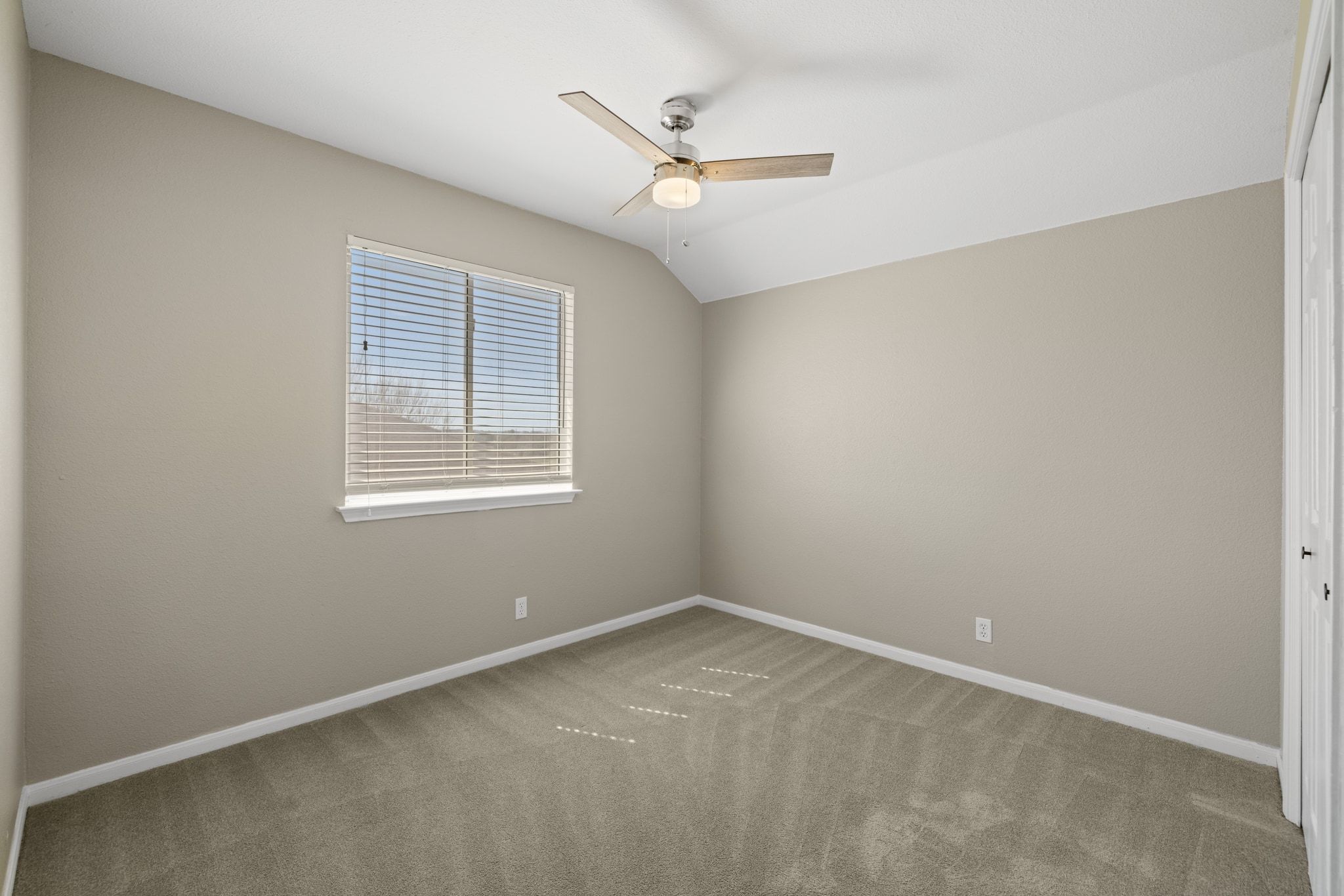 1607 Rio Bravo Loop Leander, TX 78641 - Photo 22 of 31 an empty room with a ceiling fan and windows