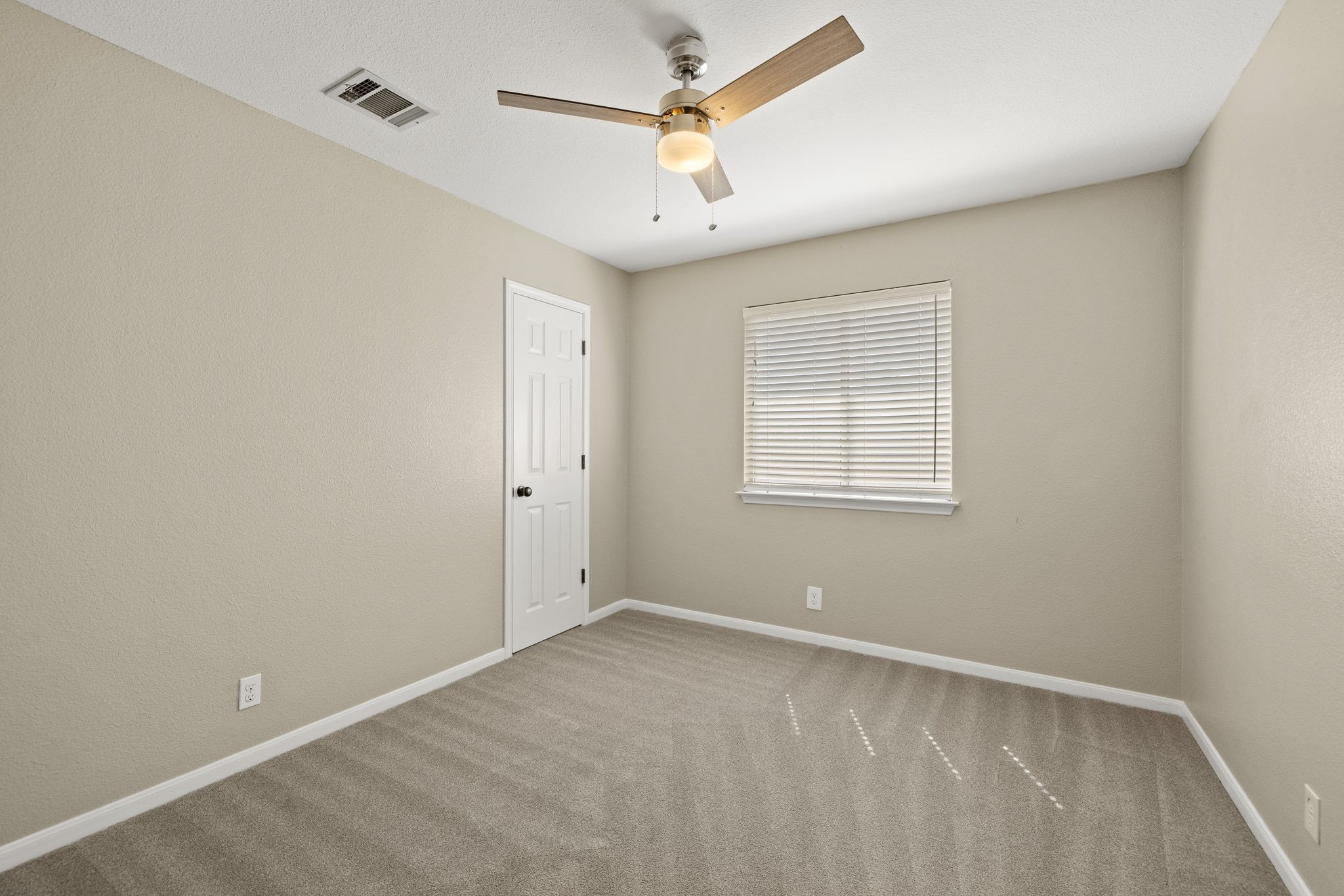 1607 Rio Bravo Loop Leander, TX 78641 - Photo 24 of 31 an empty room with windows and fan