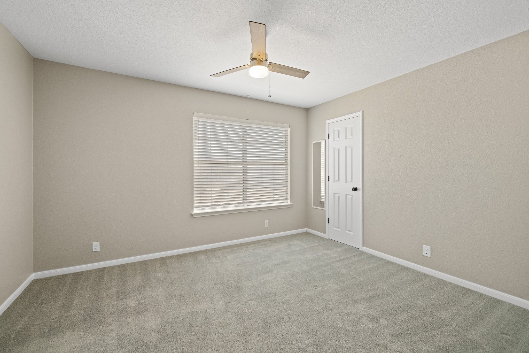 1607 Rio Bravo Loop Leander, TX 78641 - Photo 26 of 31 an empty room with windows and chandelier fan