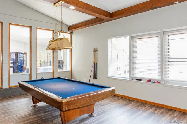 a view of room with wooden floor