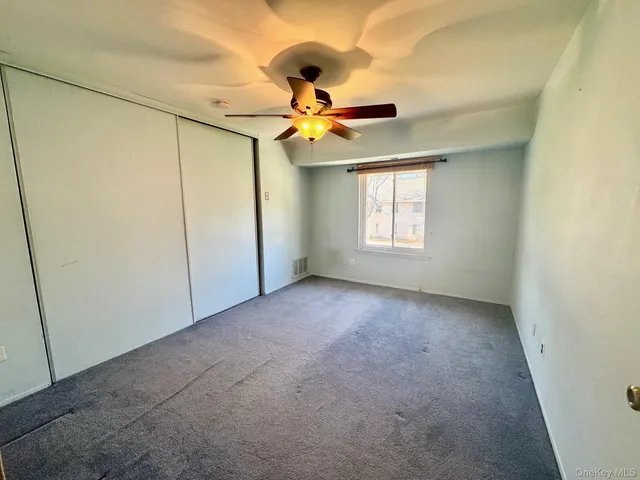 a view of a window and chandelier fan
