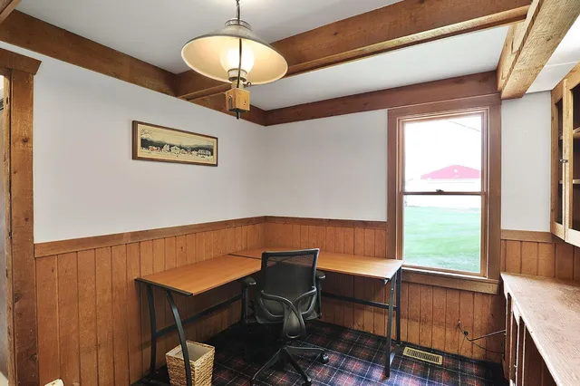 a view of a dining room with furniture window and outside view