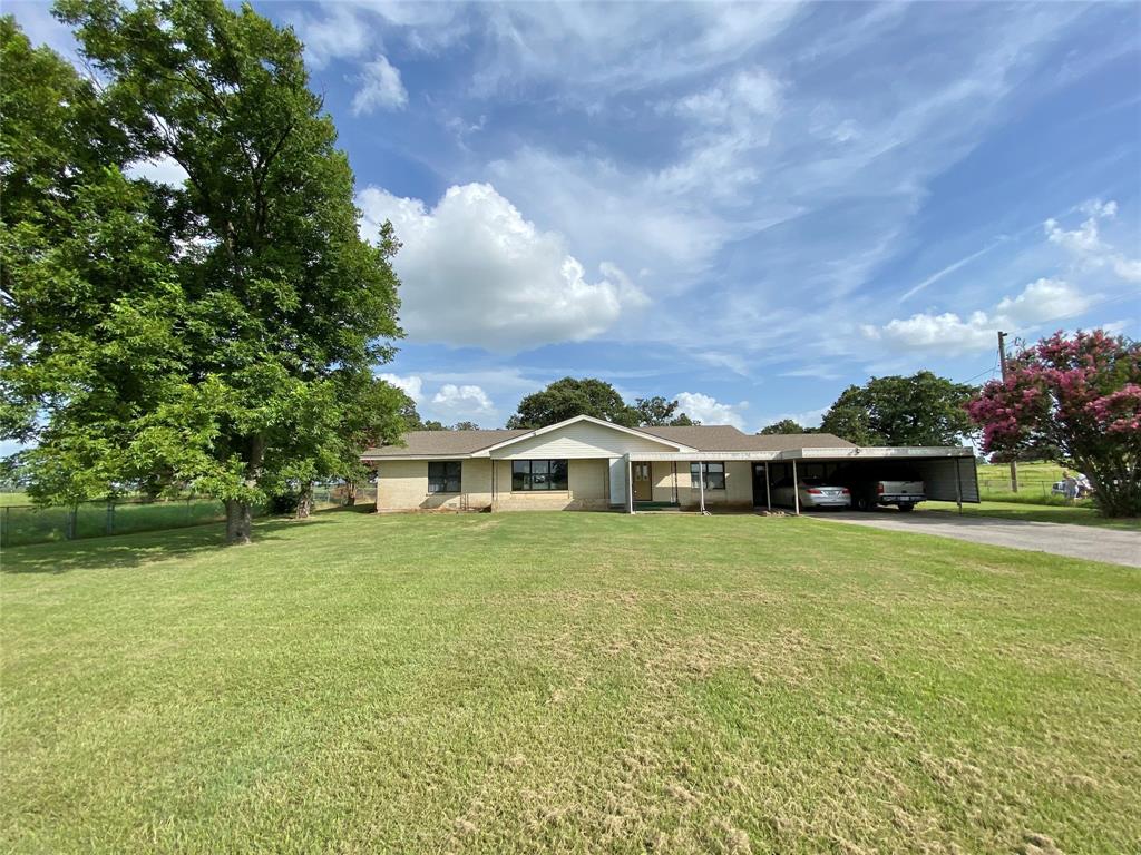 1605 Tolar Cemetery Road Tolar, TX 76476 - Photo 1 of 25 a front view of a house with a garden
