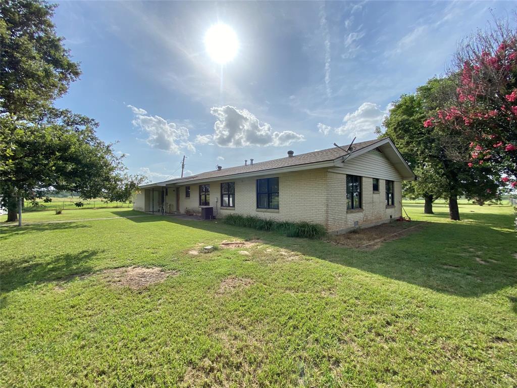 1605 Tolar Cemetery Road Tolar, TX 76476 - Photo 2 of 25 a view of a house with a big yard and a large tree