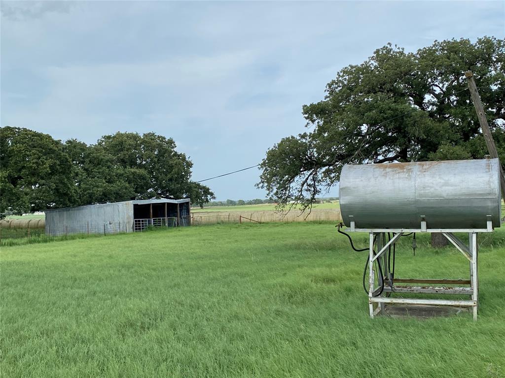 1605 Tolar Cemetery Road Tolar, TX 76476 - Photo 8 of 25 a view of a backyard with sitting area