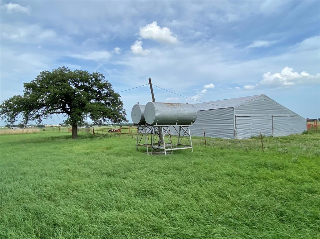 1605 Tolar Cemetery Road Tolar, TX 76476 - Photo 9 of 25 a backyard of a house with table and chairs