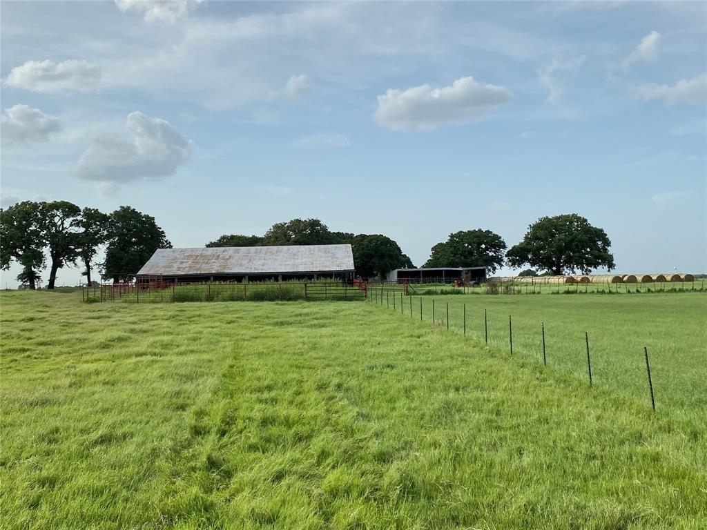 1605 Tolar Cemetery Road Tolar, TX 76476 - Photo 10 of 25 a view of an ocean and trees in the background