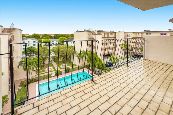 a view of balcony with furniture