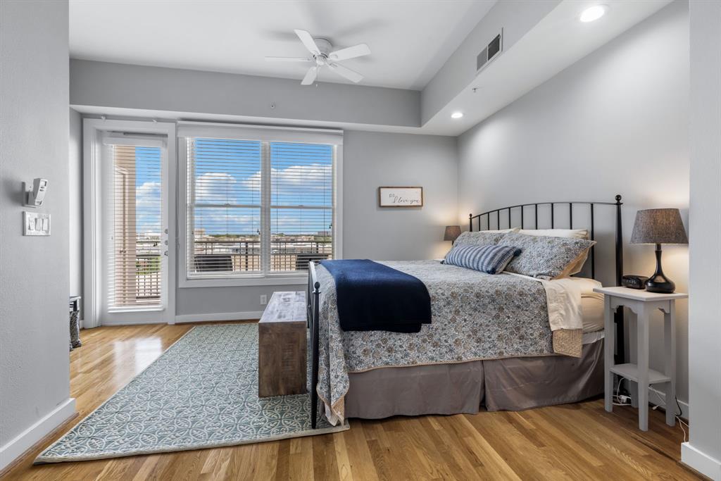 5055 Addison Circle, Unit 731 Addison, TX 75001 - Photo 21 of 40 Primary bedroom has access to a large balcony overlooking the grounds.