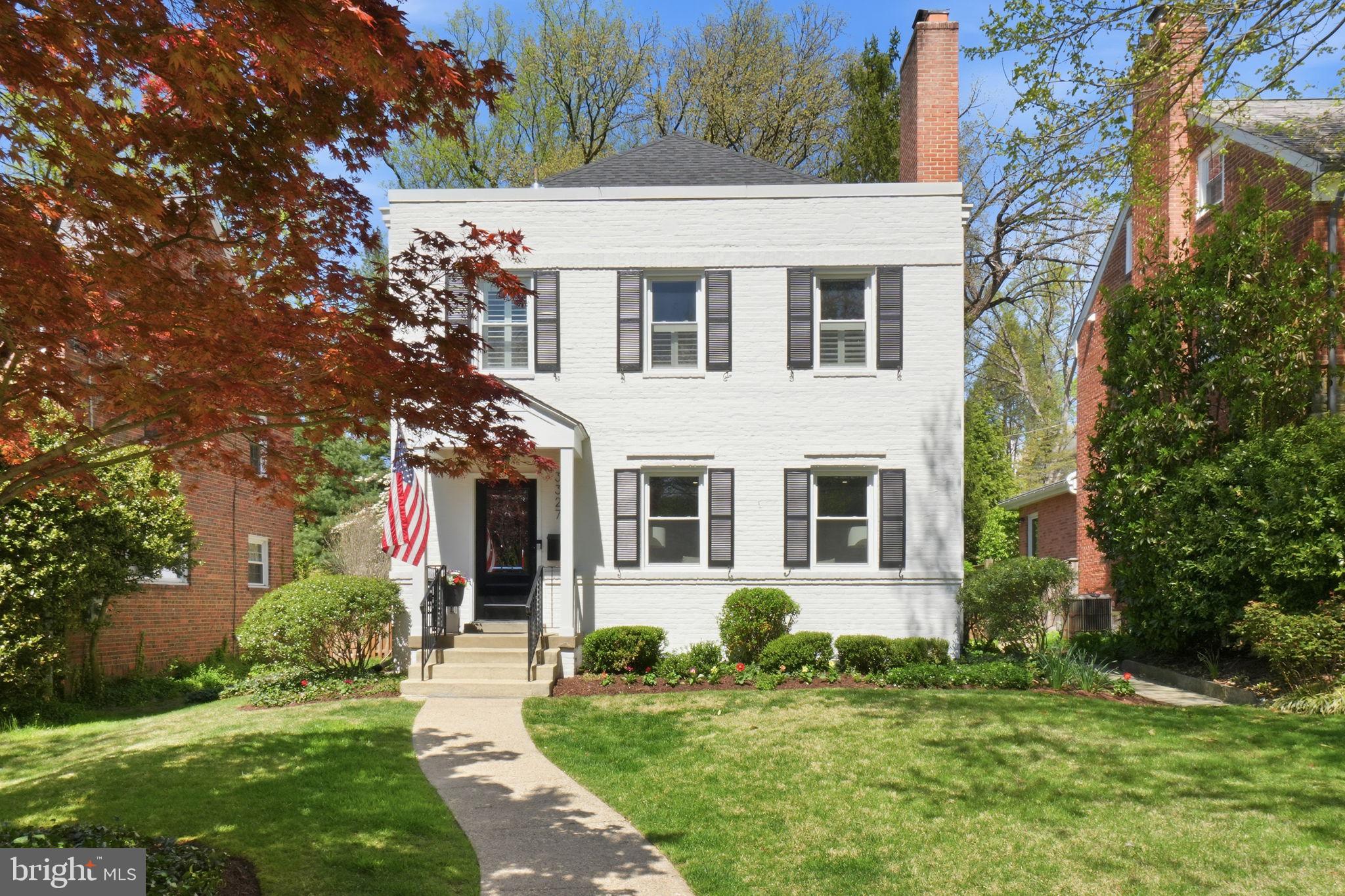 3327 Legation Street Northwest Washington, DC 20015 - Photo 1 of 36 a front view of a house with a yard