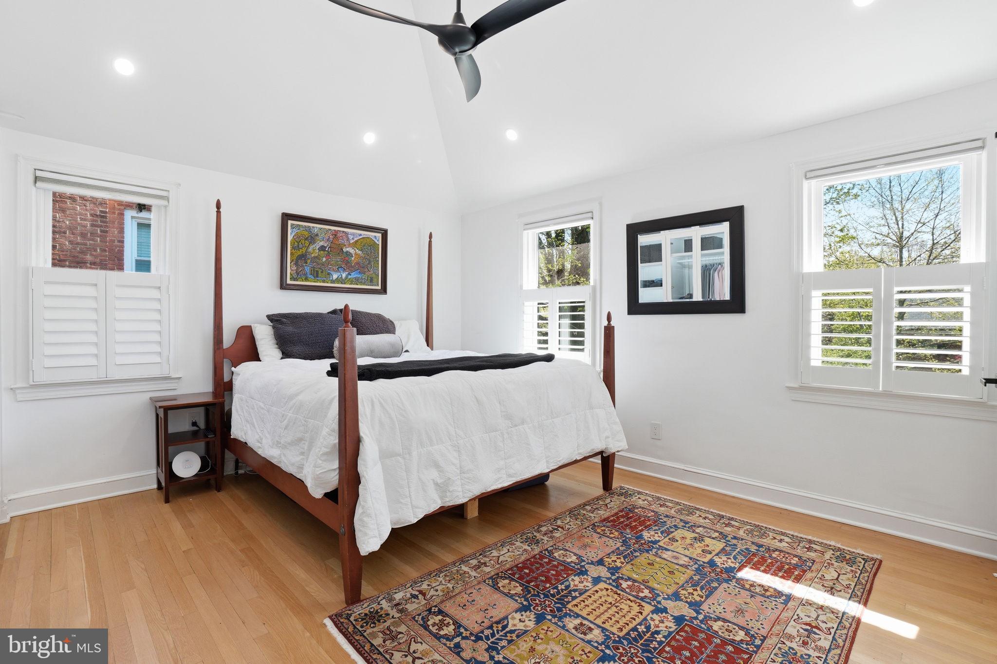 3327 Legation Street Northwest Washington, DC 20015 - Photo 18 of 36 a bed room with a bed and a painting on the wall