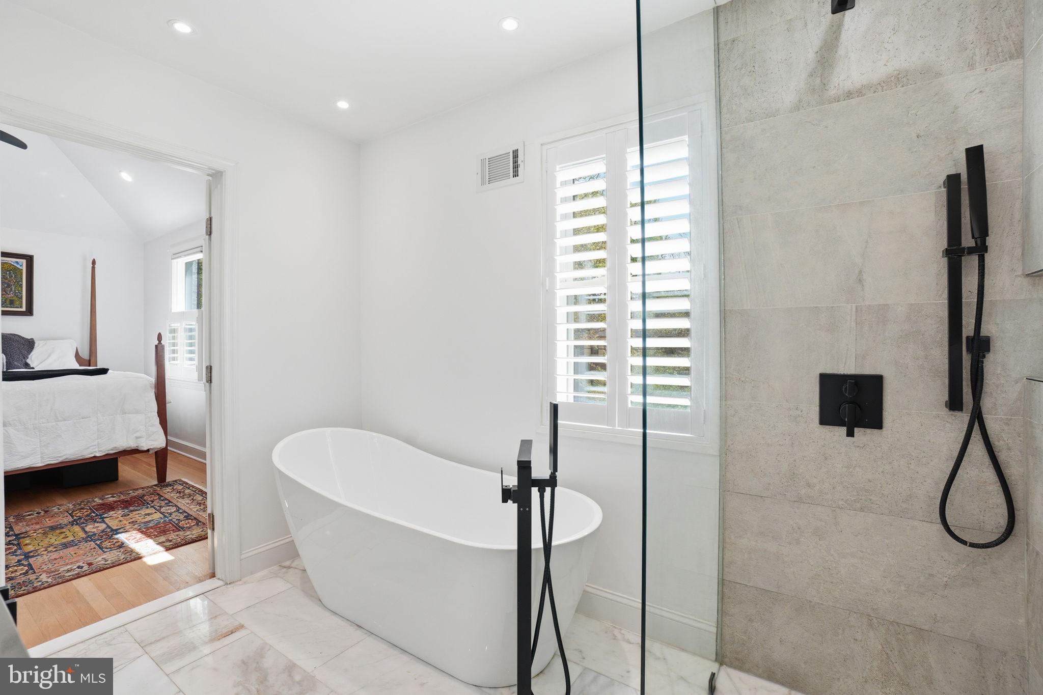 3327 Legation Street Northwest Washington, DC 20015 - Photo 22 of 36 a bathroom with a bathtub and shower