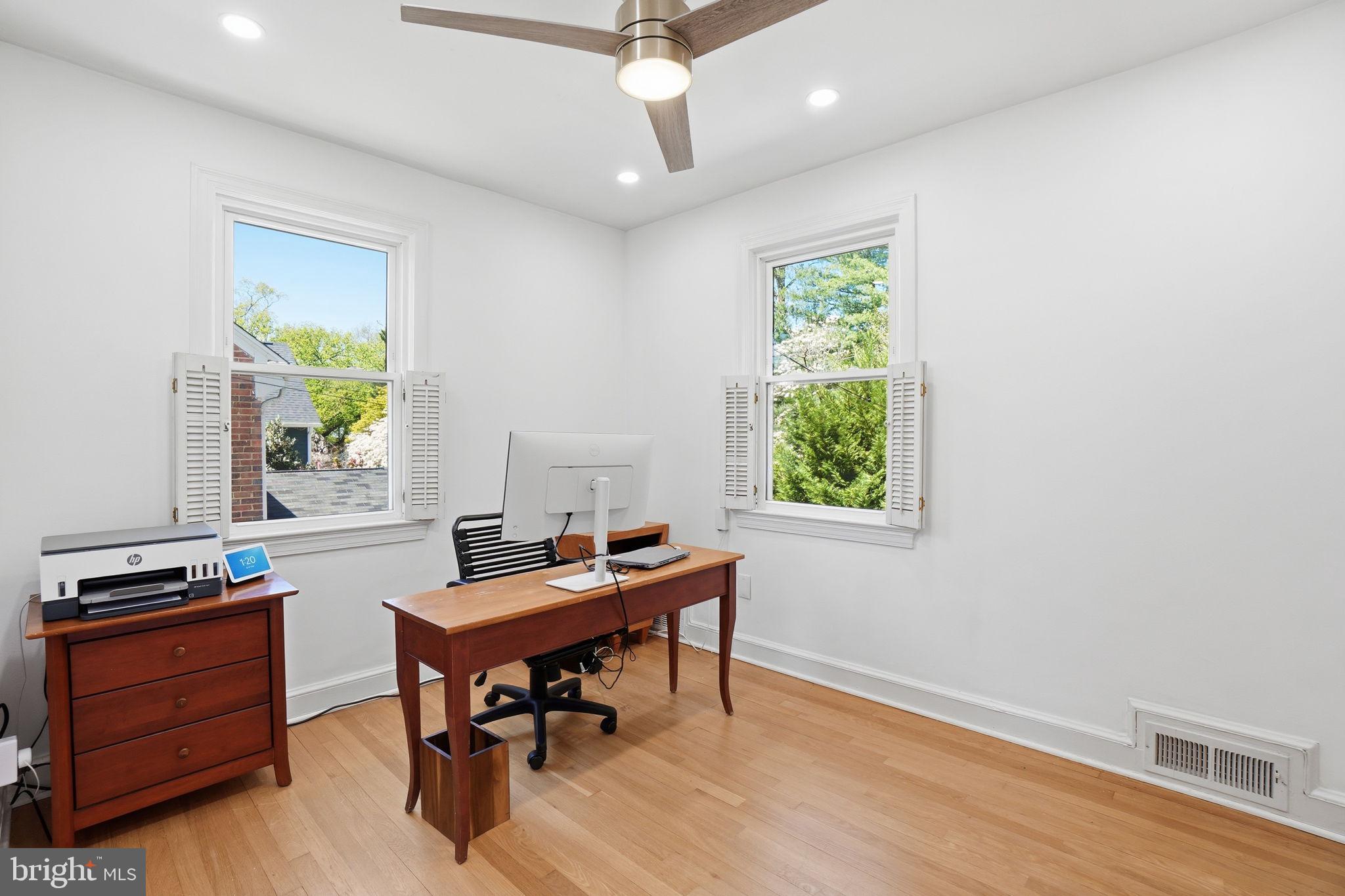 3327 Legation Street Northwest Washington, DC 20015 - Photo 25 of 36 a view of a workspace with furniture and a window