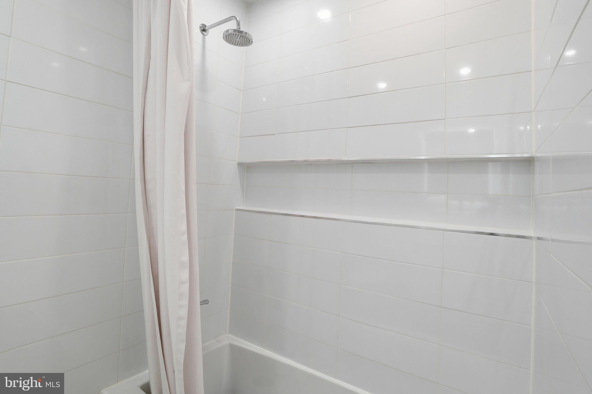 3327 Legation Street Northwest Washington, DC 20015 - Photo 27 of 36 a bathroom with a shower