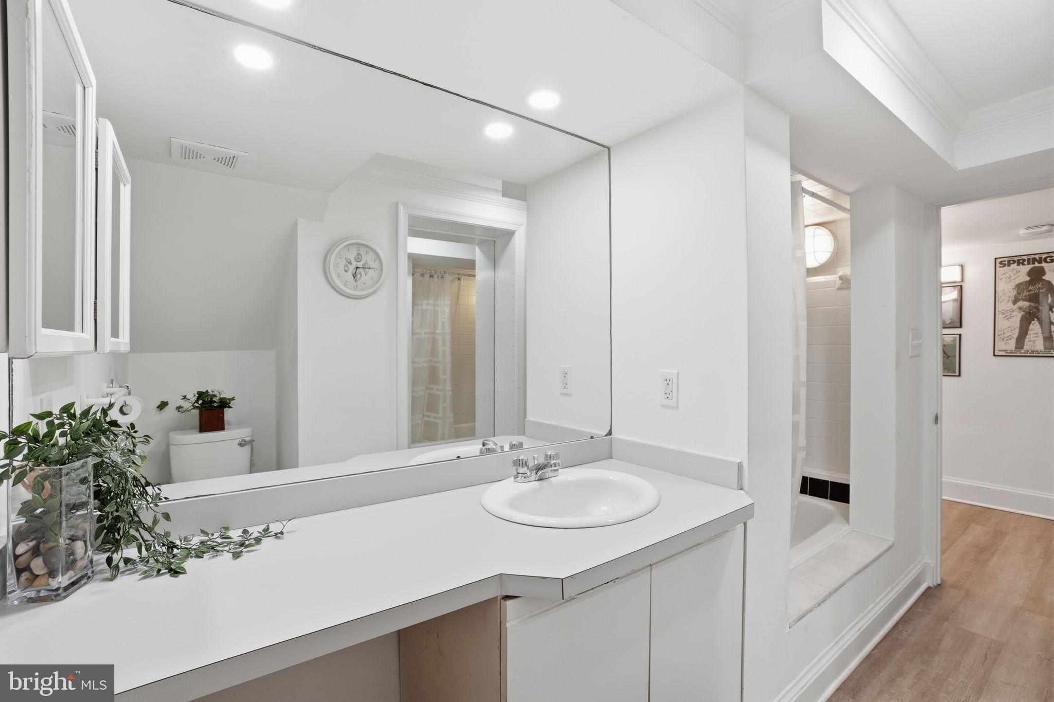 3327 Legation Street Northwest Washington, DC 20015 - Photo 30 of 36 a bathroom with a sink and a mirror