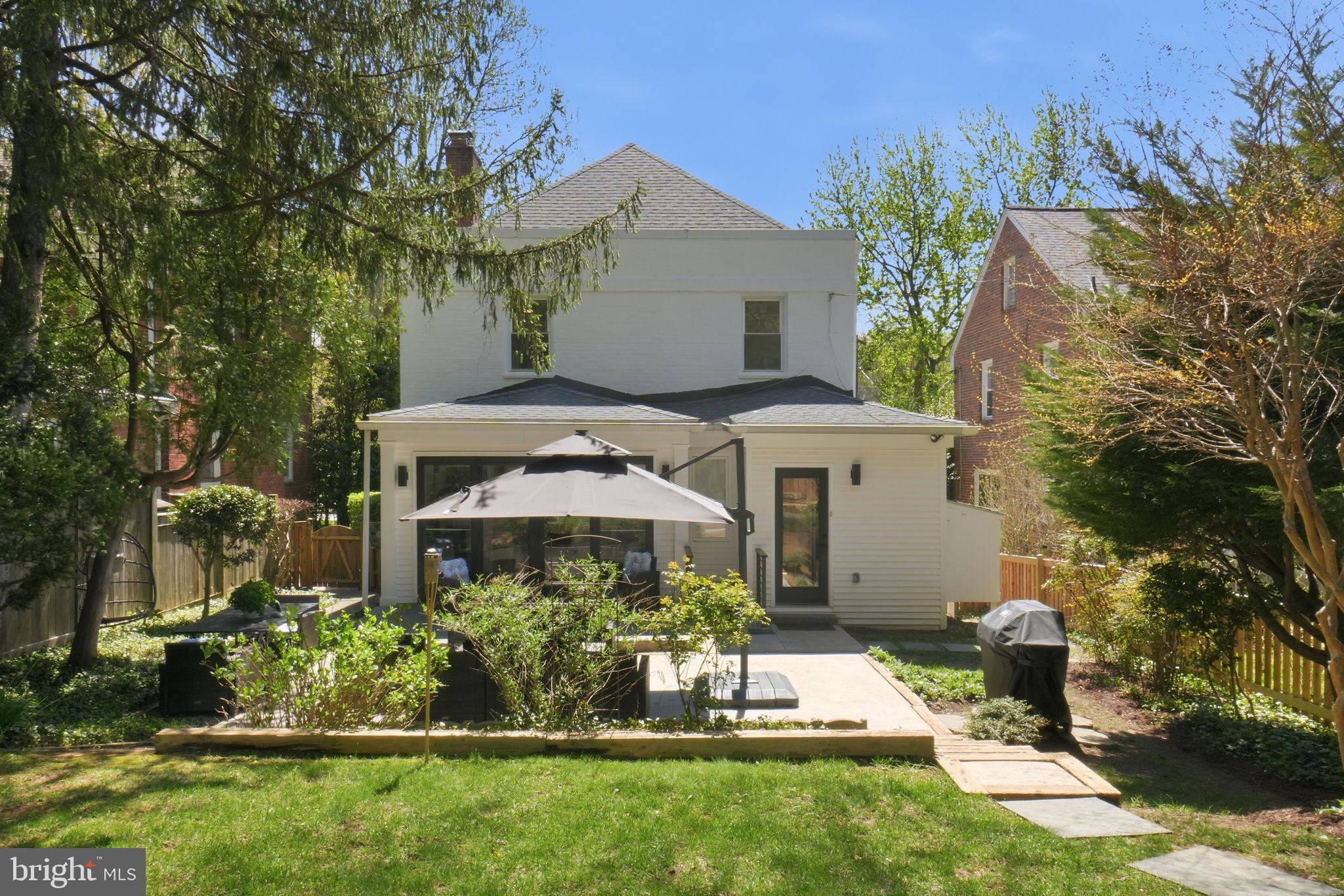 3327 Legation Street Northwest Washington, DC 20015 - Photo 32 of 36 a front view of a house with a yard