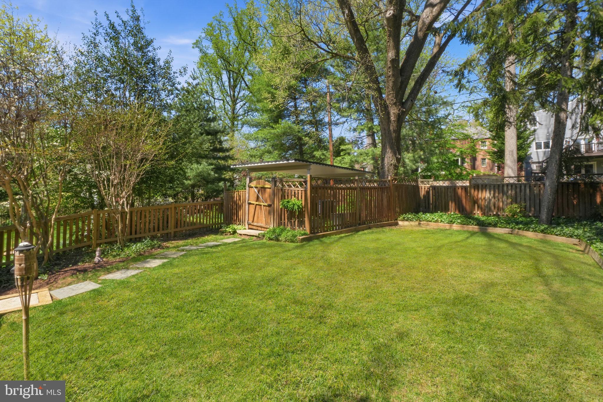 3327 Legation Street Northwest Washington, DC 20015 - Photo 35 of 36 a view of a house with a yard and sitting area