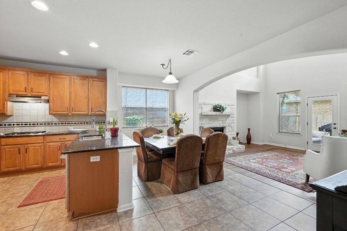 1802 Misty Ridge Leander, TX 78641 - Photo 12 of 39 a living room with granite countertop furniture and a kitchen island