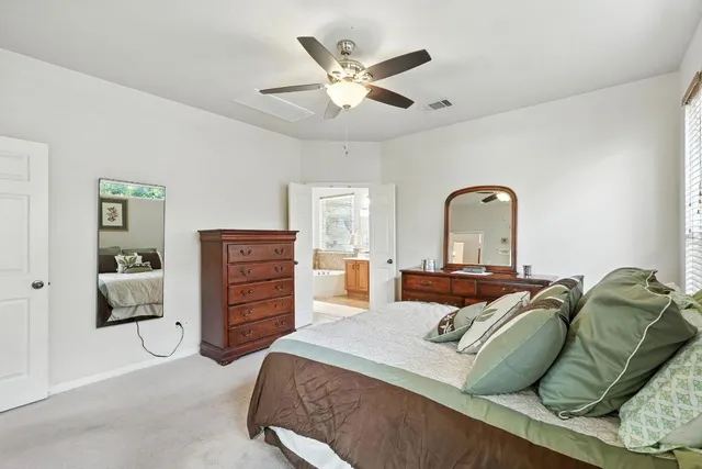 a bedroom with a bed and closet