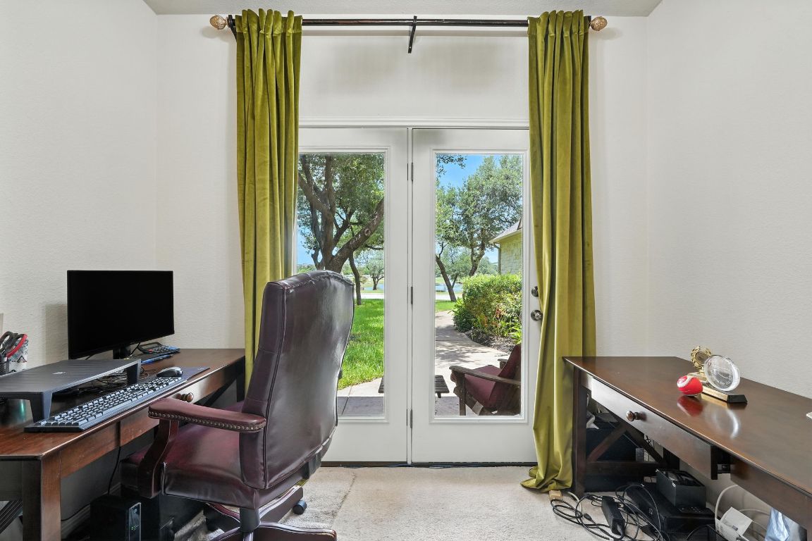 1802 Misty Ridge Leander, TX 78641 - Photo 19 of 39 a view of a workspace with furniture and a window