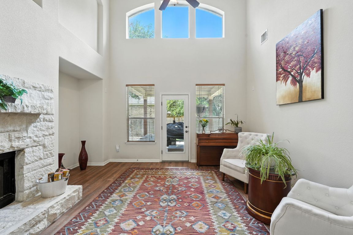 1802 Misty Ridge Leander, TX 78641 - Photo 22 of 39 a living room with furniture and a fireplace