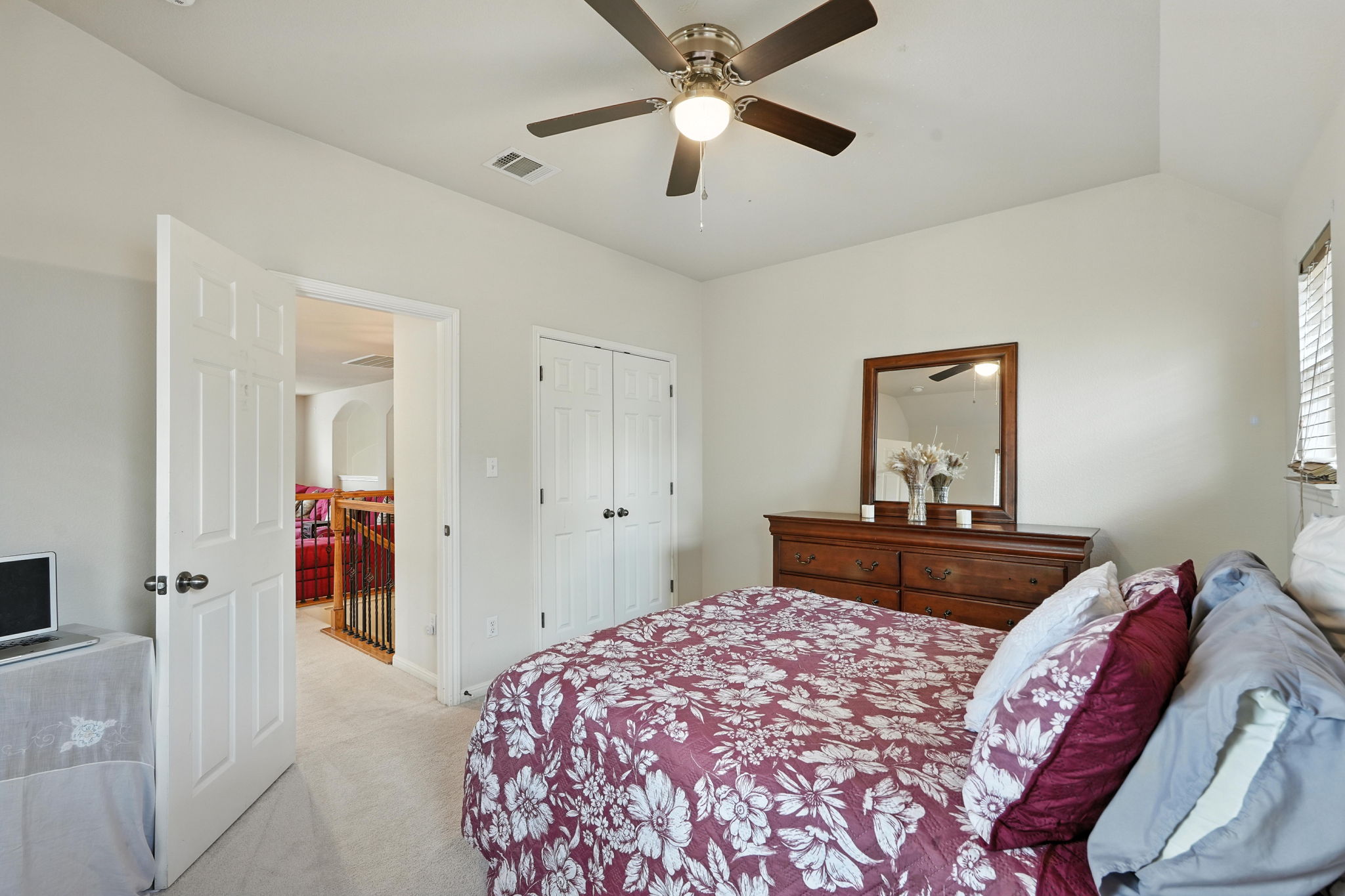 1802 Misty Ridge Leander, TX 78641 - Photo 28 of 39 Secondary bedroom featuring light carpet, a ceiling fan, and a closet on 2nd floor.