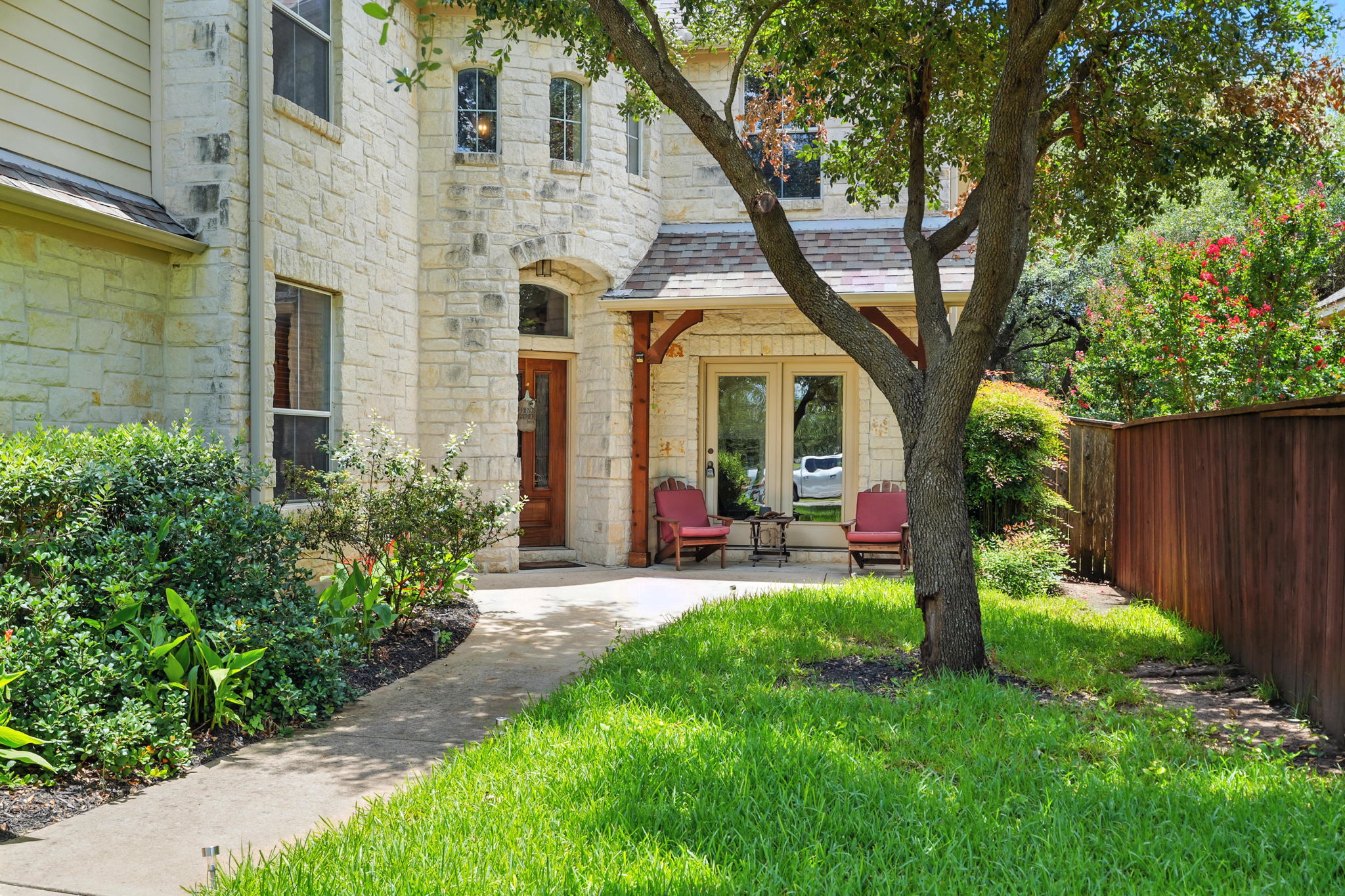1802 Misty Ridge Leander, TX 78641 - Photo 37 of 39 Entrance to property featuring stone siding and a shingled roof