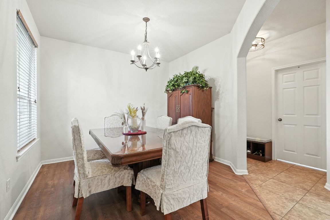 1802 Misty Ridge Leander, TX 78641 - Photo 9 of 39 a view of a dining room with furniture and wooden floor