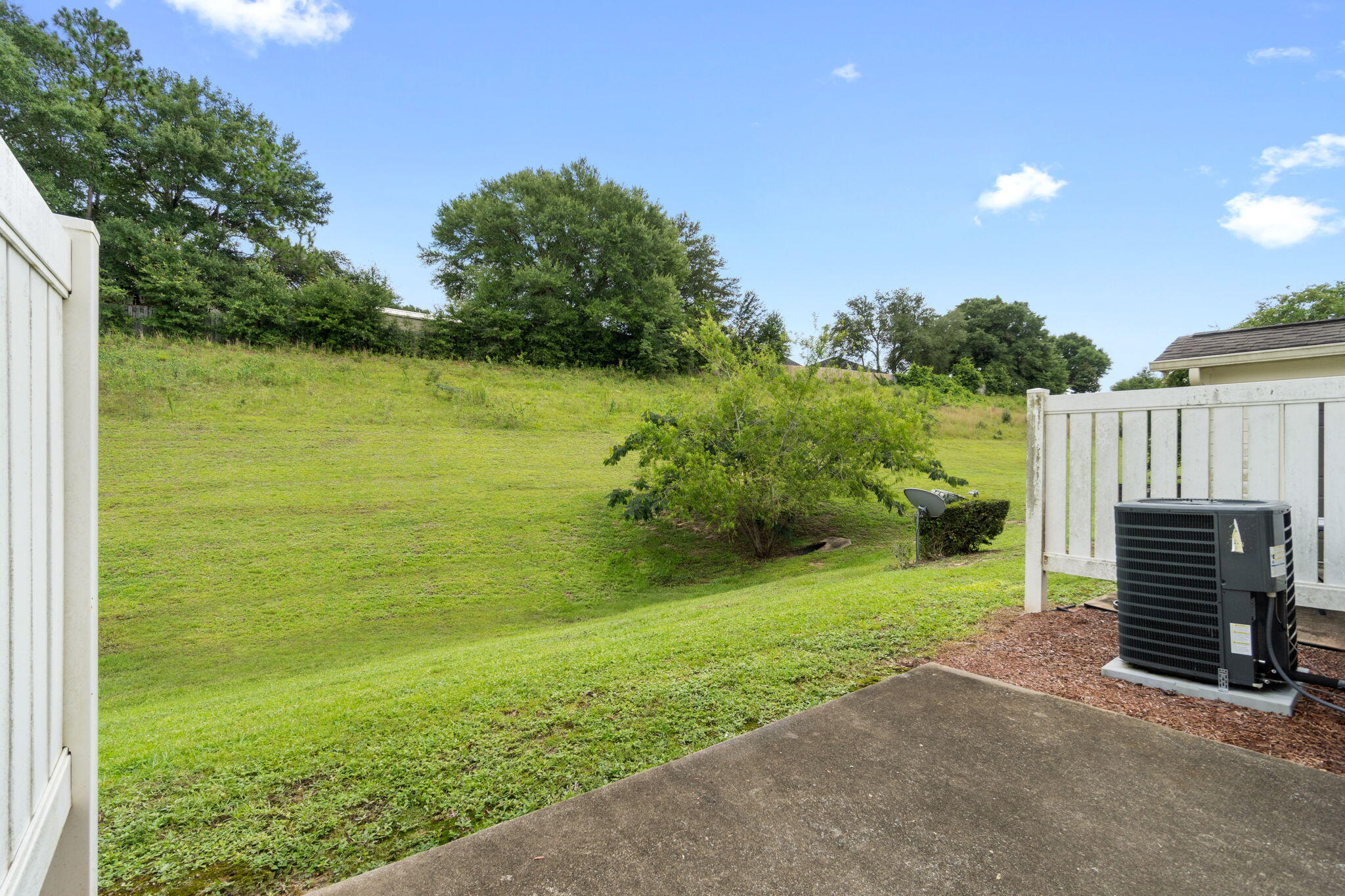 554 Wingspan Way Crestview, FL 32536 - Photo 18 of 20 a view of a garden with an outdoor space and seating area