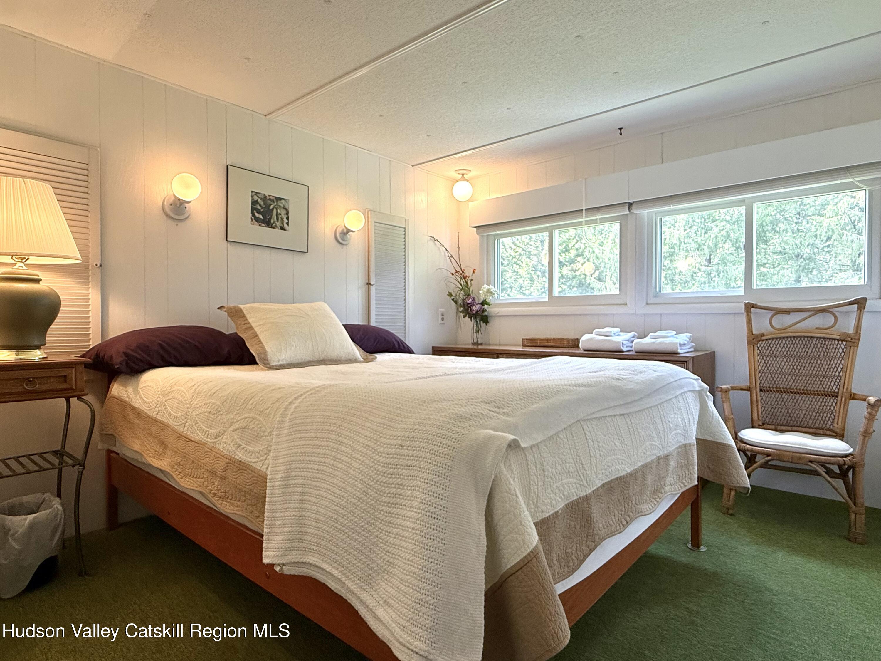 221 Colgate Road East Jewett, NY 12424 - Photo 19 of 34 a bedroom with a bed and window
