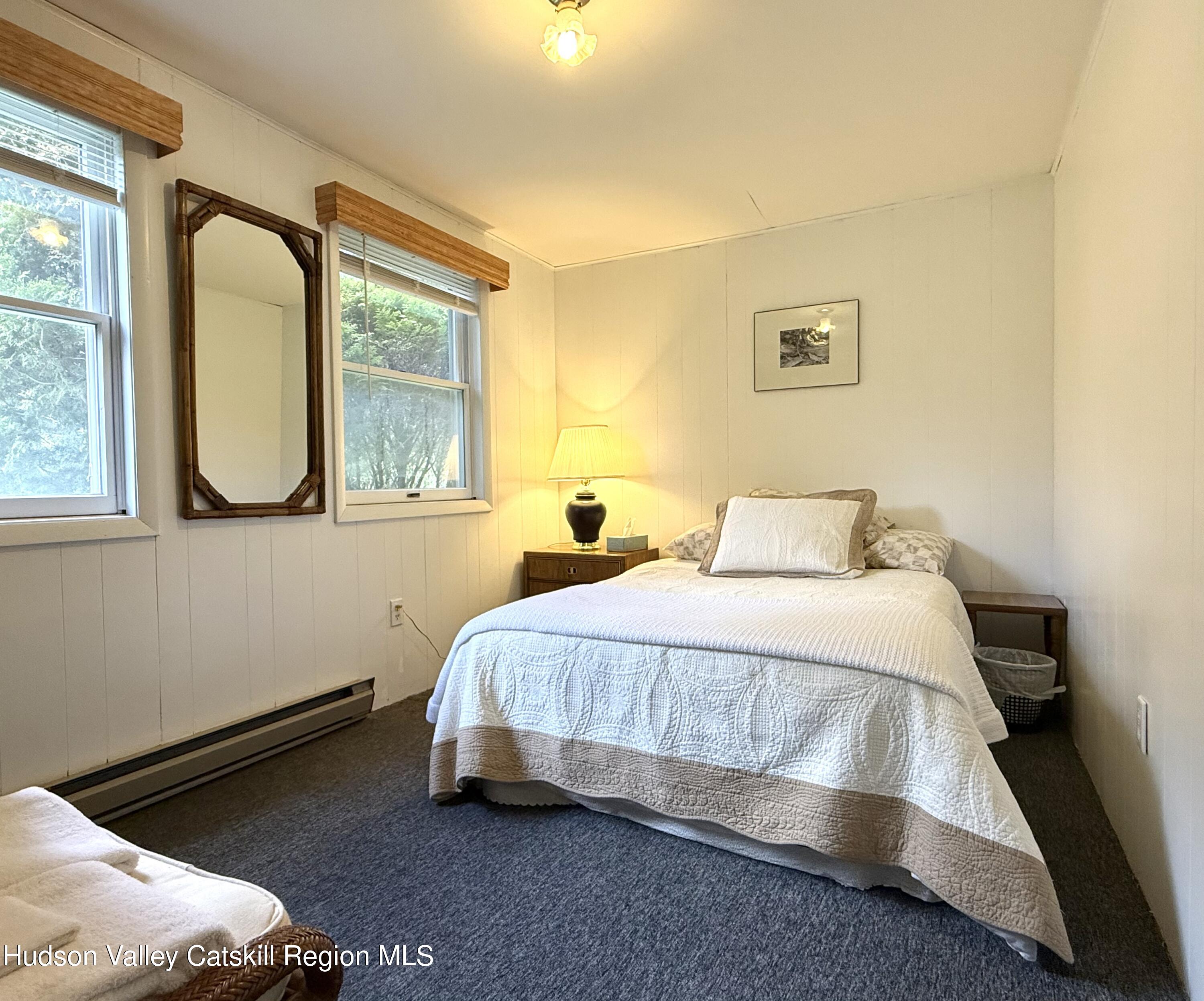221 Colgate Road East Jewett, NY 12424 - Photo 21 of 34 a bedroom with a bed and window