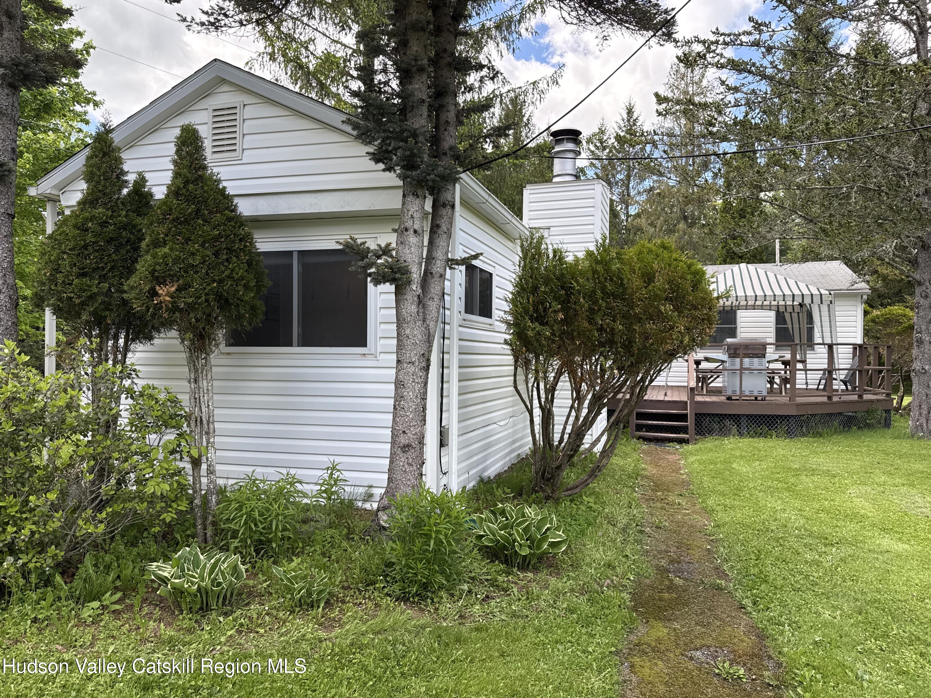 221 Colgate Road East Jewett, NY 12424 - Photo 29 of 34 a view of a house with backyard and sitting area