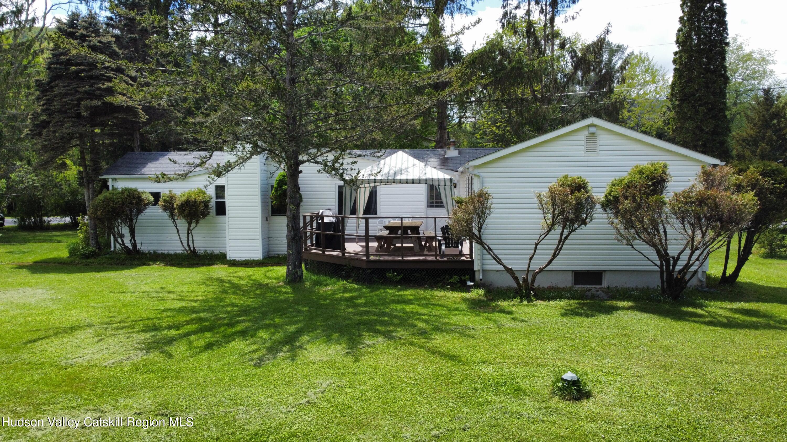 221 Colgate Road East Jewett, NY 12424 - Photo 3 of 34 a view of a house with a yard and sitting area