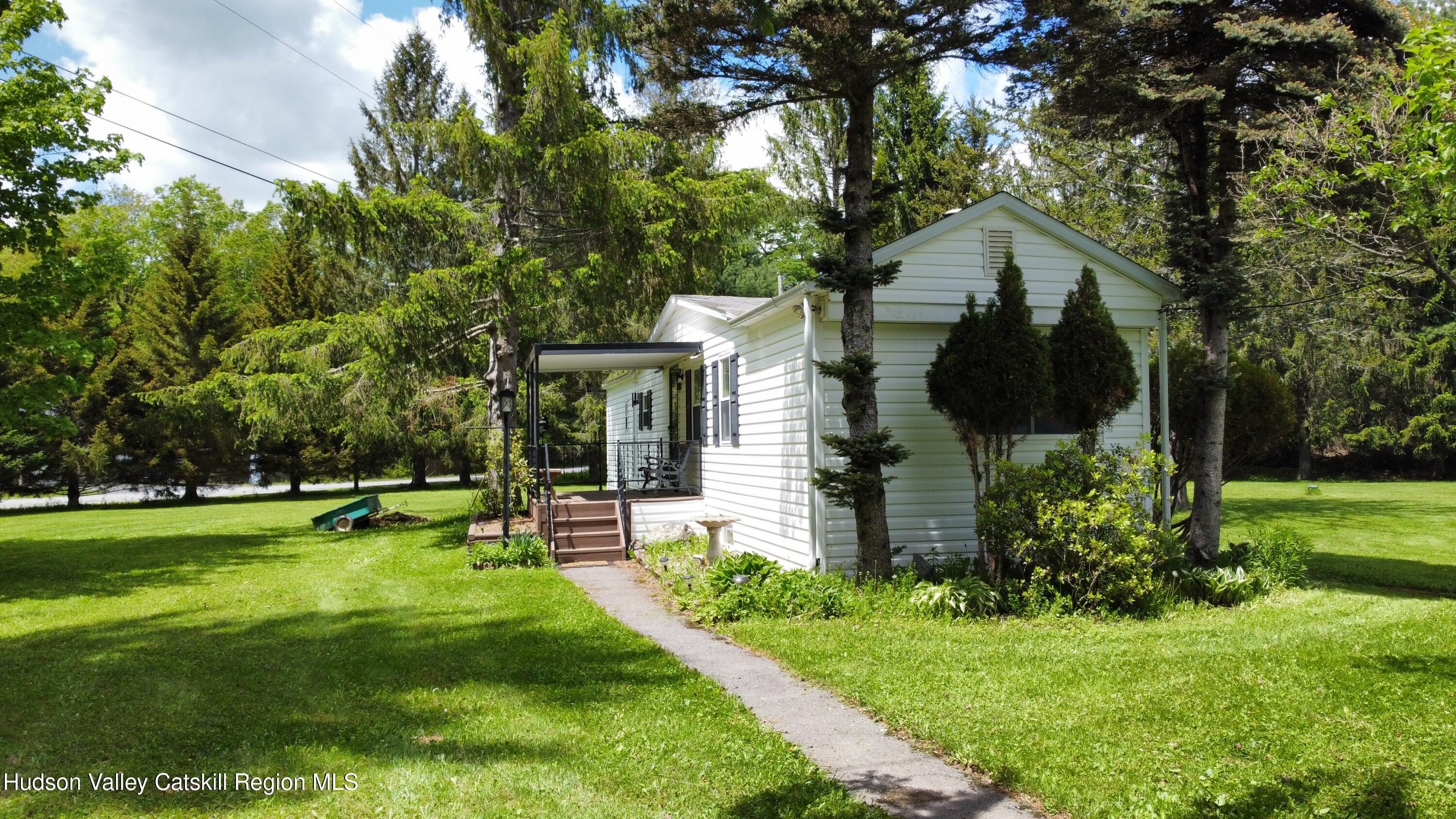 221 Colgate Road East Jewett, NY 12424 - Photo 5 of 34 a front view of house with a garden and patio