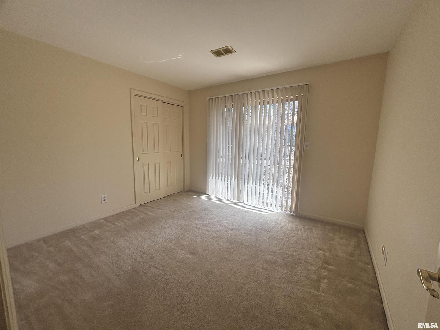 920 17th Street, Unit 28 Moline, IL 61265 - Photo 10 of 17 a view of empty room with windows