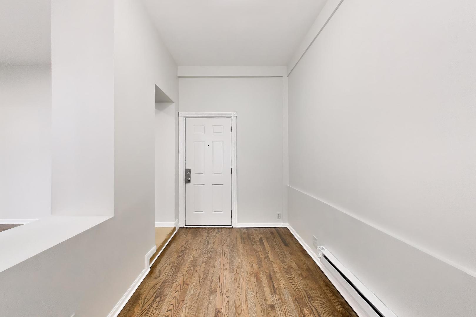 2135 West Division Street, Unit 1R Chicago, IL 60622 - Photo 11 of 12 a view of a small space with wooden floor and a window