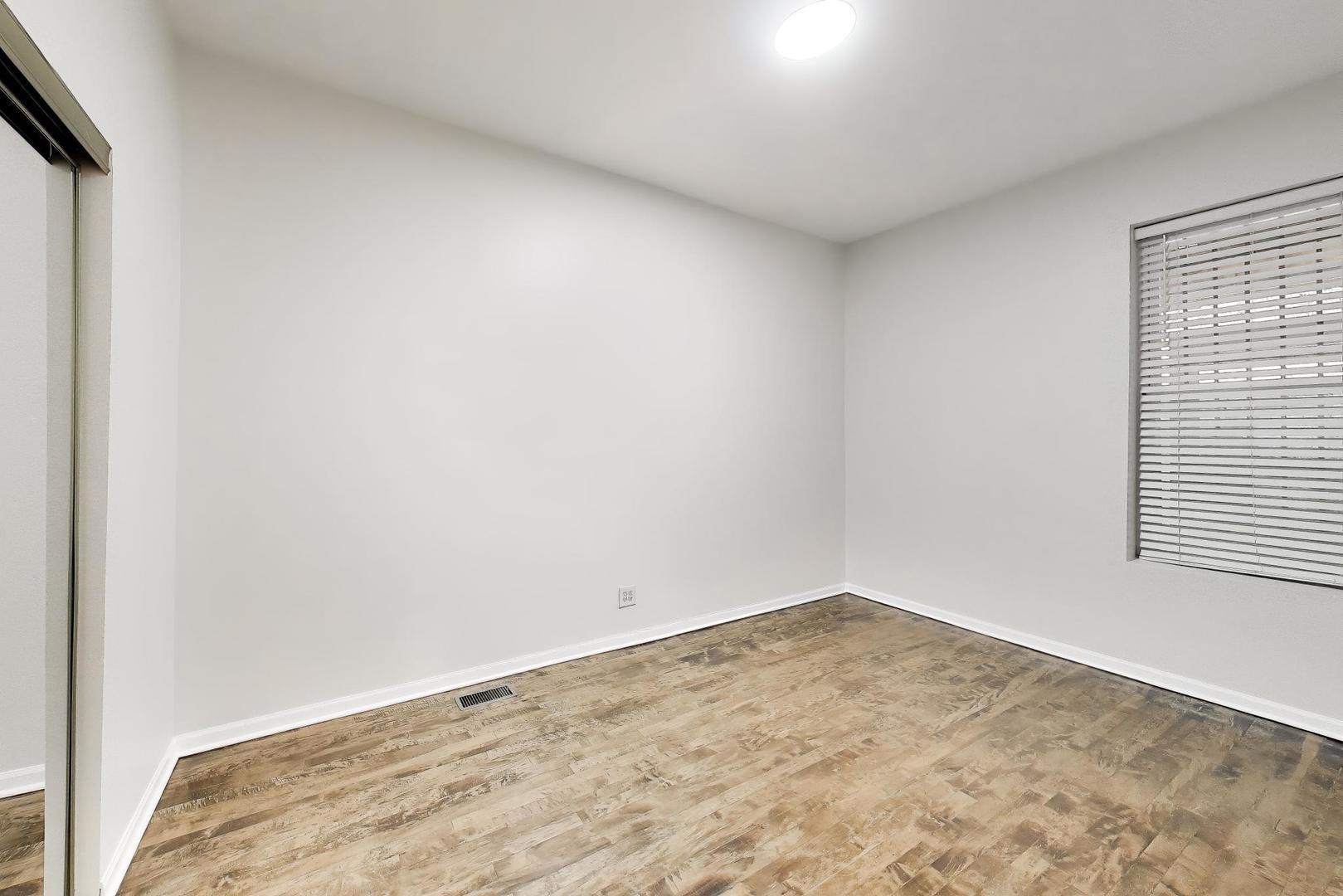 2135 West Division Street, Unit 1R Chicago, IL 60622 - Photo 10 of 12 an empty room with a window