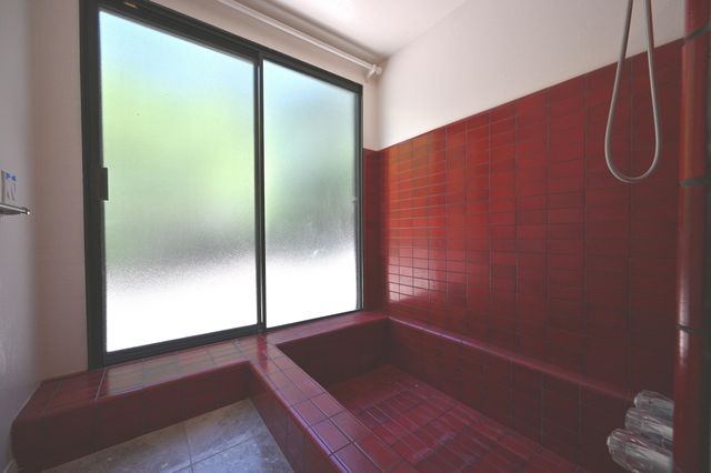 a bathroom with a glass shower door