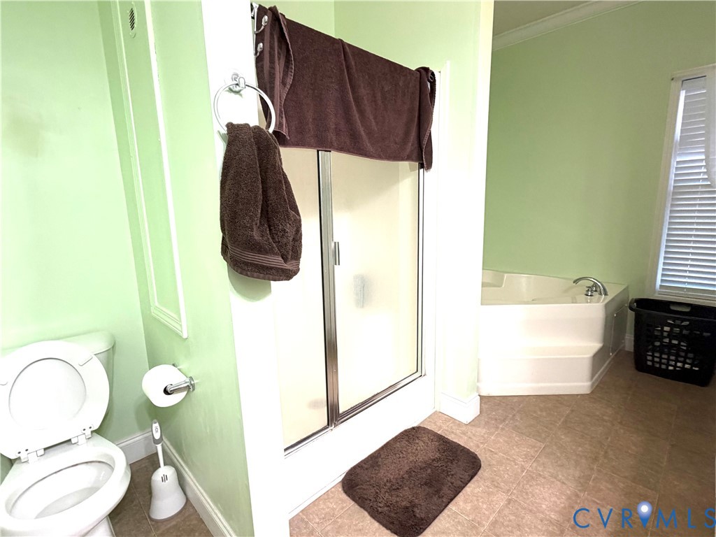 14558 Brick Road Petersburg, VA 23805 - Photo 23 of 27 Bathroom with a shower stall, a garden tub, and or